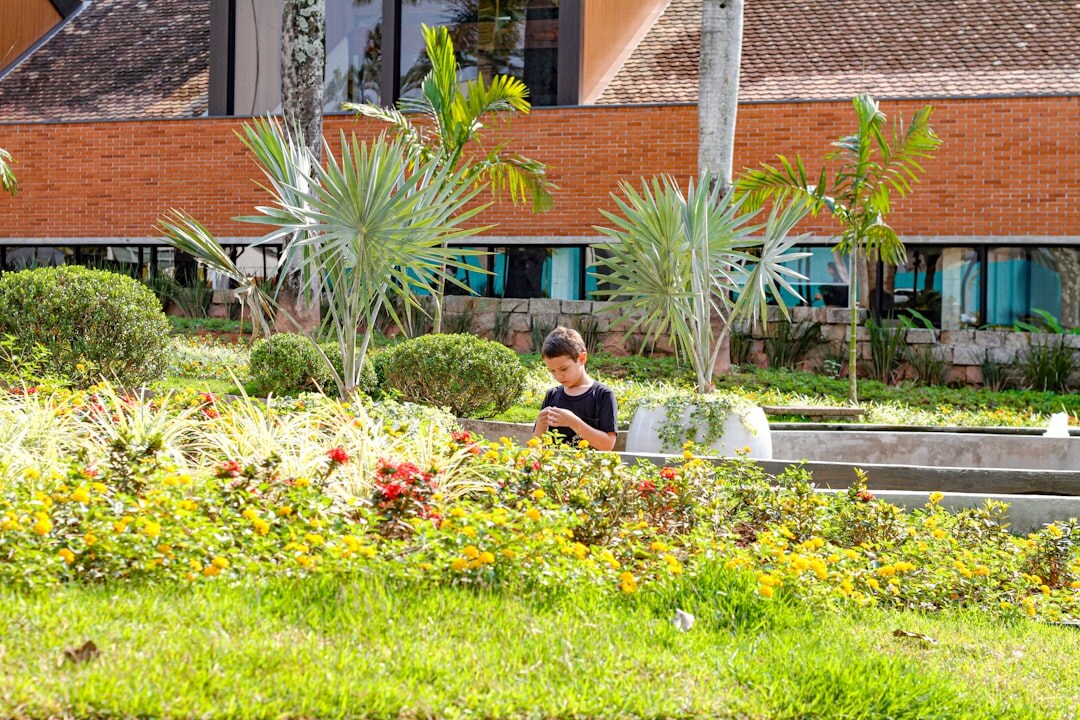 senior woman reading book in garden