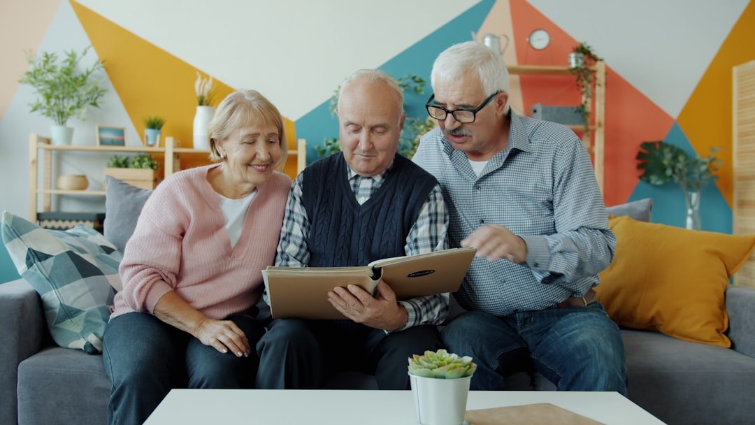 seniors laughing together in a cozy living room