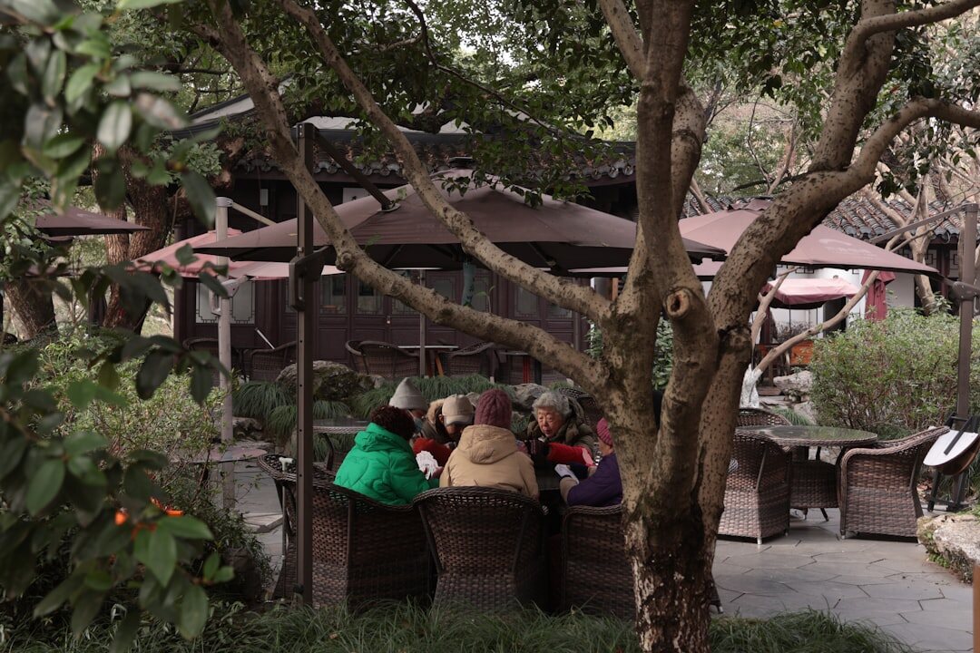 elderly friends chatting in garden