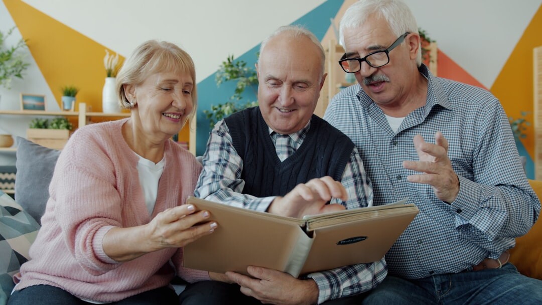 seniors laughing together in a cozy living room